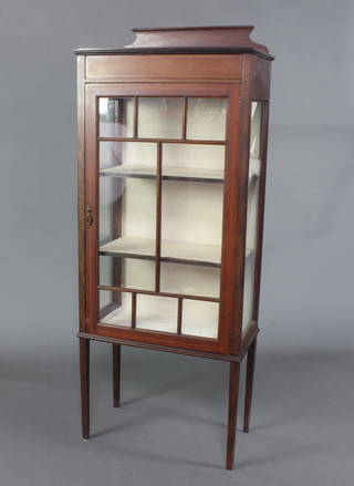 An Edwardian inlaid mahogany display cabinet with raised back, fitted shelves enclosed by astragal glazed panelled doors, raised on square tapered supports 152cm x 61cm x 35cm 