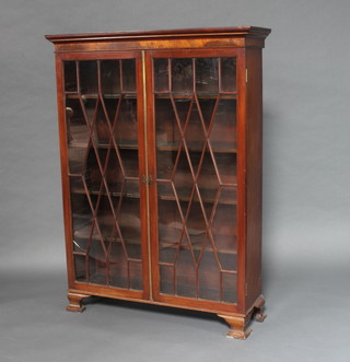 A Georgian mahogany bureau bookcase top with moulded cornice, interior fitted adjustable shelves enclosed by astragal glazed panelled doors, raised on later ogee bracket feet 149cm h x 109cm w x 37cm d 