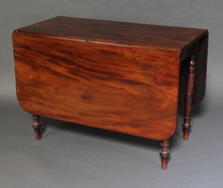 A 19th Century mahogany drop flap dining table on turned supports 72cm h x 107cm w x 48cm x 148cm when open 