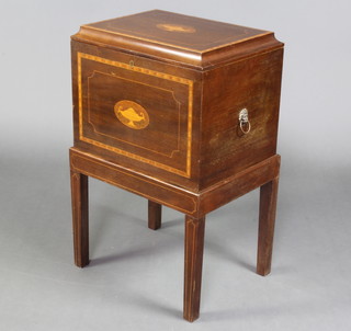 An Edwardian style rectangular inlaid mahogany cellarette raised on square tapered supports 79cm x 48cm x 37cm 