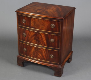 A Georgian style mahogany bow front chest of 3 long drawers with ring drop handles, raised on bracket feet 67cm h x 52cm w x 40cm d 