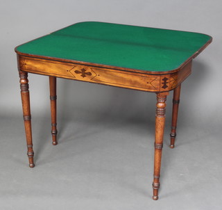 A Regency mahogany and inlaid brass D shaped card table with ebonised stringing raised on turned supports 73cm h x 91cm d x 45cm w 