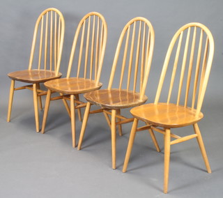 A set of 4 Ercol beech and elm stick back dining chairs 