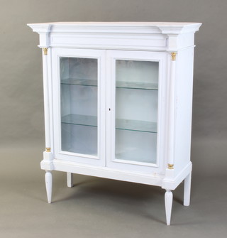 A Continental "Wedgwood" blue painted cabinet, fitted shelves enclosed by glazed panelled doors and with columns to the sides 140cm h x 117cm w x 48cm d  