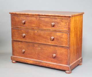 A Victorian mahogany chest of 2 short and 2 long drawers with tore handles, raised on bun feet 83cm h x 104cm w x 51cm d (some damage to the handles) 