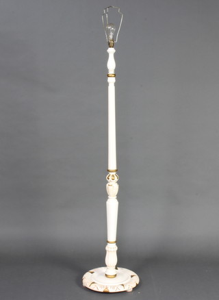 A white and gold painted turned and fluted standard lamp 
