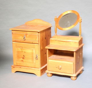 An oval plate dressing table mirror contained in a pine swing frame the base fitted a recess 55cm x 42cm x 21cm together with a pine bedside cupboard 43cm x 46cm x 37cm, 1 other bedside cabinet 67cm x 49cm x 44cm 