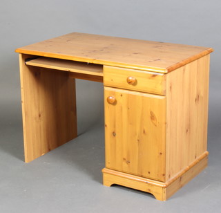 A pine desk/dressing table, fitted a drawer above a cupboard 73cm x 100cm x 58cm together with a square beech footstool upholstered in red material 34cm x 40cm x 33cm 