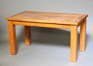 A rectangular oak dining table raised on square supports 76cm h x 80cm x 104cm 
