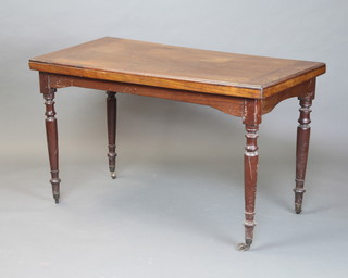 A Victorian rectangular walnut side table raised on turned supports 72cm x 120cm x 60cm 