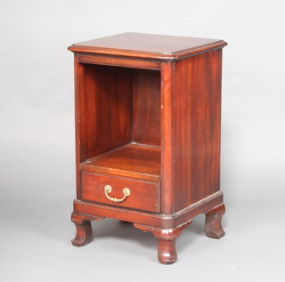 A hardwood bedside cabinet fitted a recess above a drawer raised on cabriole supports 71cm x 43cm x 40cm 