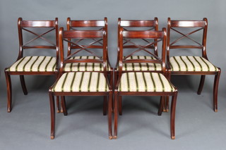 A set of 6 Georgian style mahogany bar back dining chairs with X framed backs and upholstered drop in seats, raised on rear tapered supports 