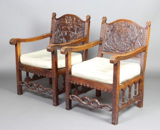 A pair of dark stained Continental hardwood open arm chairs, the backs carved mythical birds and with serpent carved stretchers