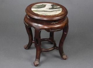 A 19th Century circular Chinese hardwood jardiniere stand with black and white veined marble top, raised on cabriole supports with circular stretcher 45cm h x 36cm diam. 
