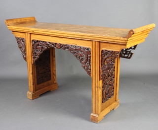 A Chinese pierced and carved light hardwood altar table with pierced apron 96cm x 172cm x 48cm  