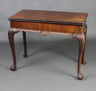 A 19th Century Chippendale style mahogany card table with gadrooned border raised on carved ball and claw club feet 72cm x 90cm x 45cm 