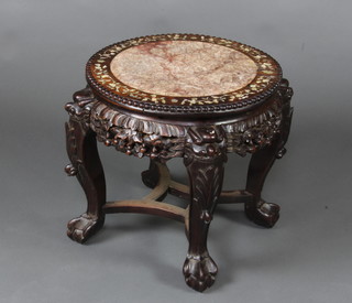 A circular carved pierced and inlaid Chinese hardwood jardiniere stand with pink veined marble top, raised on cabriole supports with box stretcher 44cm x 44cm 