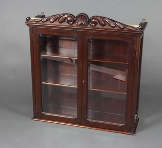 A William IV carved mahogany wall mounting display cabinet fitted shelves enclosed by glazed panelled doors 84cm h x 79cm w x 26cm d 