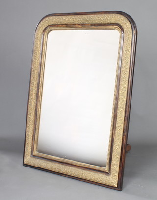 A 19th Century arch shaped mirror contained in a tortoiseshell and gilt effect frame 96cm x 79cm 