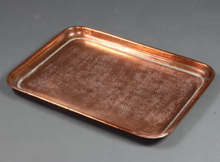 A rectangular planished copper tea tray 3cm x 60cm x 44cm 