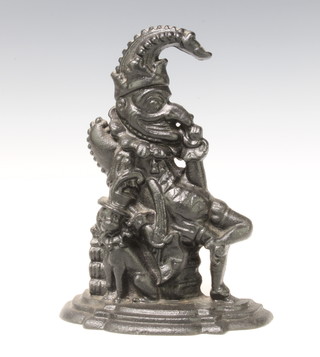 A Victorian cast iron door stop in the form of a seated Mr Punch 31cm x 22cm x 8cm 