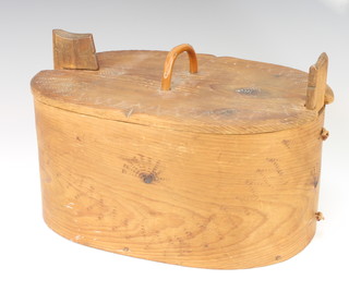 An oval wooden Shaker style box 17cm x 29cm x 19cm with light carved decoration 