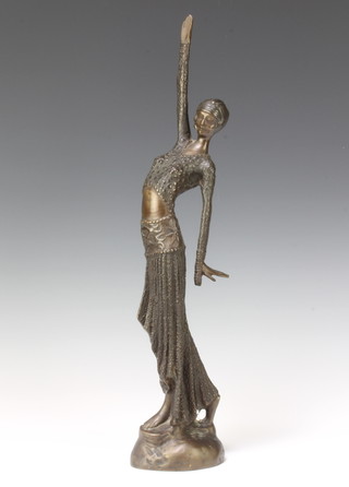An Art Nouveau style bronze figure of a standing lady raised on an oval base 46cm x 8cm x 10cm 