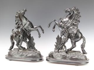 A pair of Victorian spelter figures of Marley horses raised on oval bases 44cm x 33cm x 16cm 