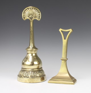 A Victorian brass bell shaped door stop 35cm x 13cm x 7cm together with an Edwardian reeded brass ditto 24cm x 12cm x 6cm 