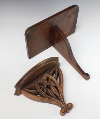 An Art Nouveau style carved mahogany wall bracket 24cm x 29cm x 14cm together with a mahogany and brass banded wall bracket 41cm x 36cm x 22cm 