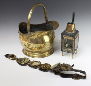 A helmet shaped coal scuttle, a brass and iron lantern 21cm x 11cm, a leather martingale hung 5 horse brases and 7 horse brasses
