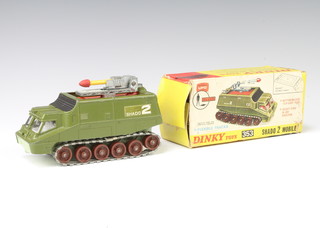 A Dinky model 353 Shado 2 Mobile tank with flip over roof and rocket launcher (from the TV show "UFO"), boxed. It is the variant with a green body and brown rollers.