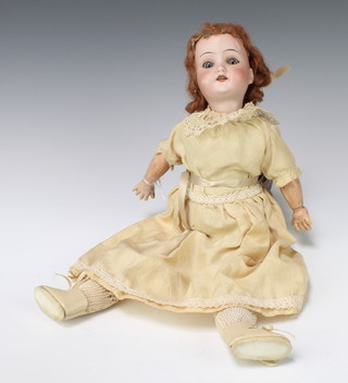 Schoenau & Hoffmeister, a porcelain doll with open and shutting eyes, open mouth with teeth, the head incised SBPH 1909 4/0 Germany 