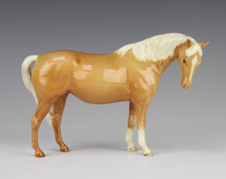 A Beswick figure of a Palomino mare (facing right, head down), no.1812, gloss, by Arthur Gredington 14.6 cm  
