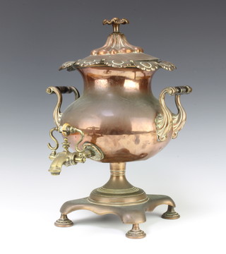 A 19th Century copper twin handled tea urn raised on a triform base with bun feet 46cm x 32cm  