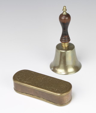 A Continental engraved oval tobacco box with hinged lid 3cm x 13cm x 5cm and a 19th Century brass bell with turned wooden handle 16cm x 7cm 