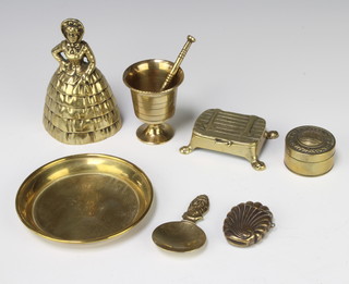 A Continental cylindrical brass jar and cover, the lid embossed a crown and marked Gott Mint Uns, a miniature brass mortar, a brass vesta case and a small collection of decorative brassware