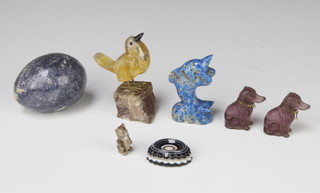 A carved hardstone model of an egg 5cm, an oval carved banded agate 1cm x 3cm x 3cm, 2 glass figures of dogs and other hardstone sculptures 