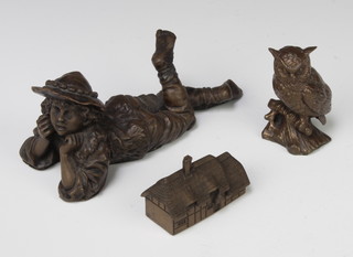 A bronzed figure of a boy 6cm x 15cm x 6cm, ditto owl 7cm x 4cm x 3cm and ditto thatched cottage 4cm x 5cm x 3cm 
