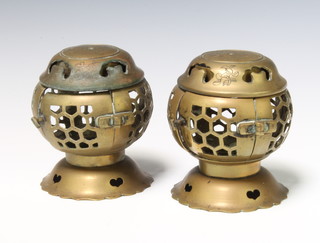 Two Chinese pierced brass melon shaped censers raised on stands 12cm x 10cm 