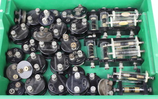 A quantity of black pill box type low ohm resistors and a collection of standard coil resistors 