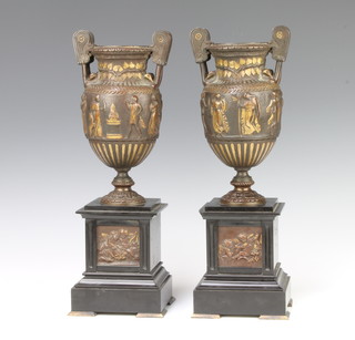 After the antique, a pair of bronze twin handled urns decorated classical figures raised on black marble bases 36cm x 11cm x 11cm 