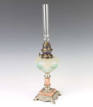An opaque glass oil lamp reservoir with floral decoration raised on a pink veined marble and white metal base 49cm h 