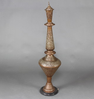 A Benares pierced brass urn and cover raised on a circular wooden base 118cm x 31cm 