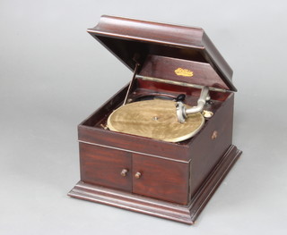 A 1930's Pltonia gramophone contained in a mahogany case, the base fitted a drawer containing a small collection of 78rpm records  
