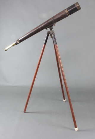 T Cooke and Sons London and New York, a military issue 2 draw brass and leather covered telescope marked Cooke and Sons Ltd London New York, no.1035 with crows foot mark and marked no.16, raised on an associated leather covered tripod 