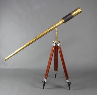 A 19th Century brass and leather 5 draw telescope together with an associated brass and chrome tripod  