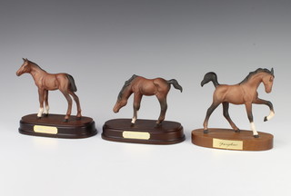 Three Beswick figures horses - Adventure no.2876, black, brown matt, Spring Time no.2837, matt brown and Young Spirit no.2839, all 11.9cm, raised on a wooden base and by Graham Tongue  
