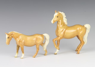 A Beswick figure of a Palomino horse (prancing Arab type), gloss, no.1261 by Arthur Gredington 17.2cm and a ditto foal 12cm 