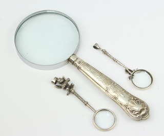 Two Continental silver handled magnifying glasses and a kings pattern ditto 
